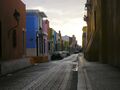 Buildings along a street in central Campeche with typical colors.