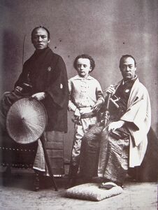 Nadar's son (center) with Yatsu Kanshiro (left) and an unnamed samurai (right), photographed by Nadar. They were members of the Second Japanese Embassy to Europe in 1863