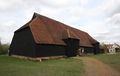 Grange barn, Coggeshall, England. This is a studded barn so the wall sheathing must be applied horizontally and covered with a siding material in this case clapboards (weatherboards).