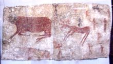 Mural of aurochs, a deer, and humans