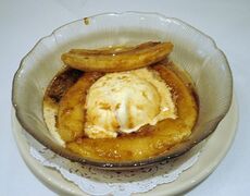 Bananas Foster, made from bananas and vanilla ice cream with a sauce made from butter, brown sugar, cinnamon, dark rum and banana liqueur