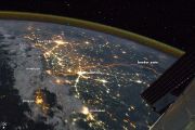 The floodlit border zone between India and Pakistan has a distinctly orange hue in this astronaut photograph.