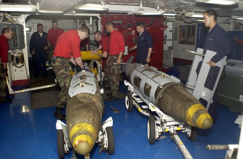 ملف:US Navy 030319-N-4142G-020 Ordnance handlers assemble Joint Direct Attack Munition (JDAM) bombs in the forward mess decks.jpg