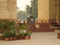 The Amar Jawan Jyoti (The flame of the immortal warrior), India's most famous war memorial situated at India Gate. A black marble cenotaph with a rifle crested by a helmet forms the main shrine.