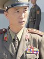 A Korean People's Army Lieutenant Colonel in the JSA. His decorations include a Kim Il Sung lapel badge, Order of the National Flag 2nd class, and two Medals For Military Service.