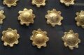 More plaques with convex bosses decorated with rosettes of petals.