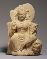 Goddess, possibly Nana, seated on a lion, 5th-6th century, Afghanistan, Hephthalite or Turkic period.[46]