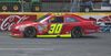 Inception Motorsports' red No. 30 Chevrolet on track at Charlotte Motor Speedway