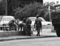 Moroccan pro-king loyalists detaining a rebel soldier.png