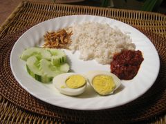 Basic simple nasi lemak with egg, anchovies, cucumber, and sambal belacan