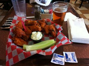 Buffalo wings and celery, with a blue-cheese dip