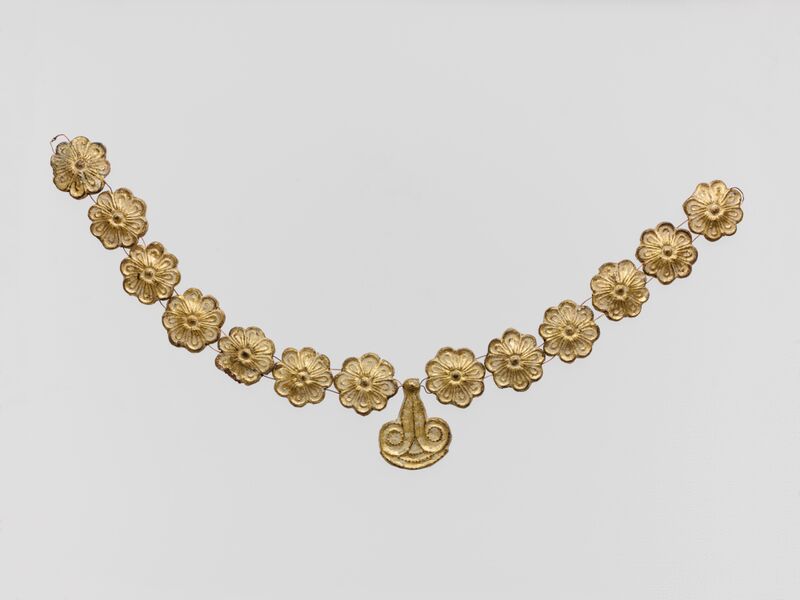 ملف:Gilt terracotta ornaments from a necklace MET DP145718.jpg