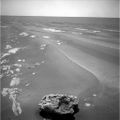 On 18 July 2009 Opportunity eyed an oddly shaped, dark rock, which was found to be a meteorite.