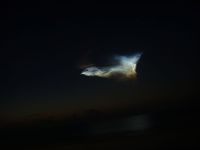 The noctilucent cloud[9] in this photograph was created by the exhaust gas from the Delta II 7925 rocket used to launch Phoenix.