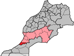 إقليم سيدي إفني (بالأحمر)، داخل جهة كلميم واد نون (بالوردي)، داخل المغرب.