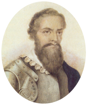 Half-length monochrome portrait of a bearded man with a lace collar over armor.