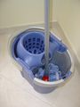 A mop bucket with a wringer.