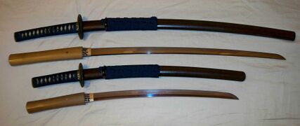 Antique Japanese (samurai) daisho, showing the matched set of mounts (koshirae).