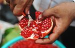 An Indian Muslim vendor separates the seeds of a pomegranate at a roadside stall in preparation for Muslims breaking their fast at sundown in Mumbai, India on August 19, 2010. (SAJJAD HUSSAIN/AFP/Getty Images)