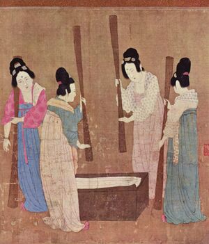A painted image of four Chinese women wearing colourful silk robes, their hair tied up into buns, standing around a small wooden block with silk laid on top while holding large whisks which they use to beat the silk