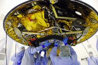 A photograph showing NASA engineers working on the Phoenix Mars Lander