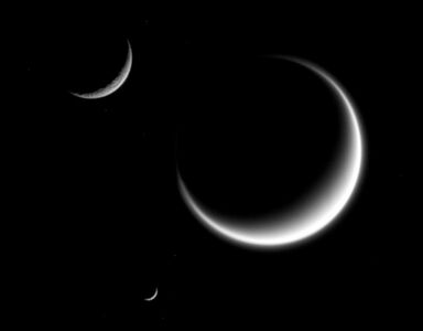 Mimas (smallest) together with Rhea and Titan in crescent shape, forming a triple crescent.[39]