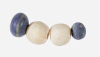 Beads of lapis lazuli and travertine, circa 3650 –3100 BCE. Naqada II–Naqada III.