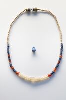 Egyptian necklace and pendant, using lapis lazuli imported from Afghanistan, possibly by Mesopotamian traders, Naqada II circa 3500 BCE, British Museum EA57765 EA57586.[34][35][36]