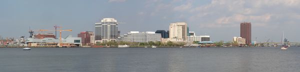 Norfolk skyline as seen from Portsmouth, stretching from USS Wisconsin (BB-64) to the Berkley Bridge.