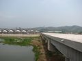 Bridge across the Rehe, with new housing development and Sledgehammer Peak visible in the background.