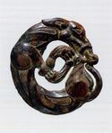 Harness ornament in the shape of a coiled wolf, characteristic of nomadic artifacts of southern Ningxia and southeastern Gansu, 5th-4th century BC.[26][24]