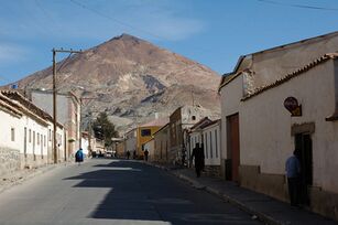 A street in Potosí with Cerro Rico in the background.