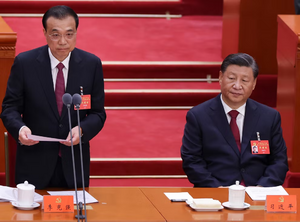 الرئيس الصيني شي جن‌پنگ، ورئيس الوزراء السابق لي كى‌چيانگ